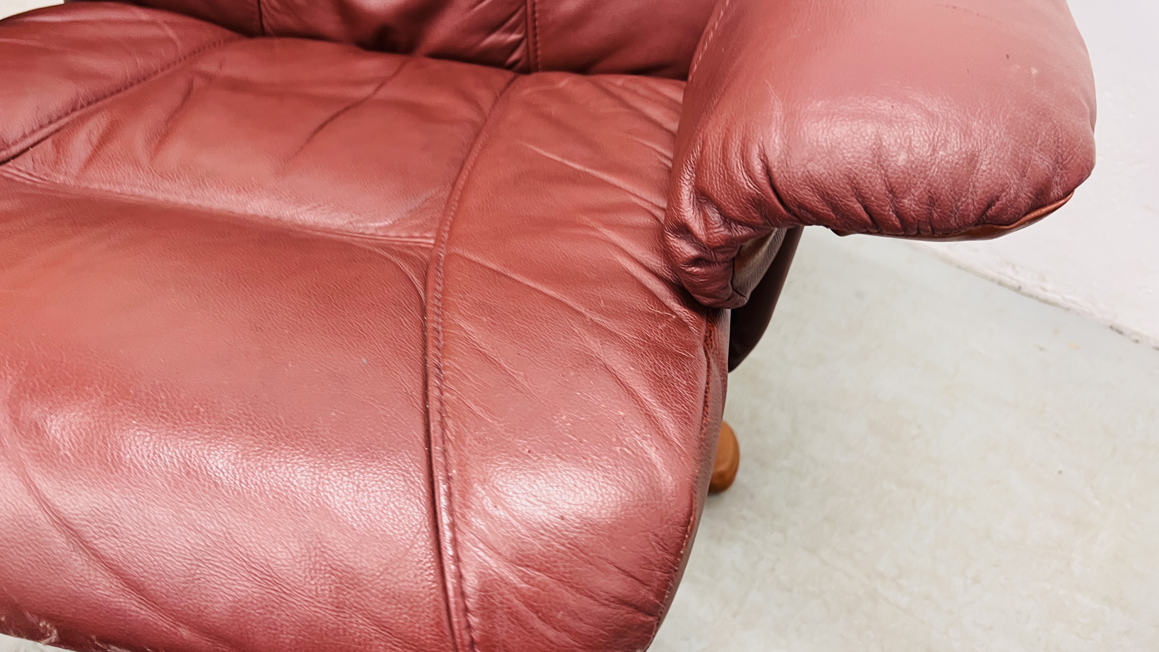 A PAIR OF RED LEATHER REVOLVING ARMCHAIRS WITH FOOTSTOOLS. - Image 19 of 25