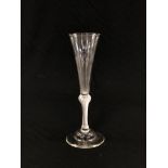 A GLASS WITH AIR TWIST STEM ON DOMED CIRCULAR FOOT,