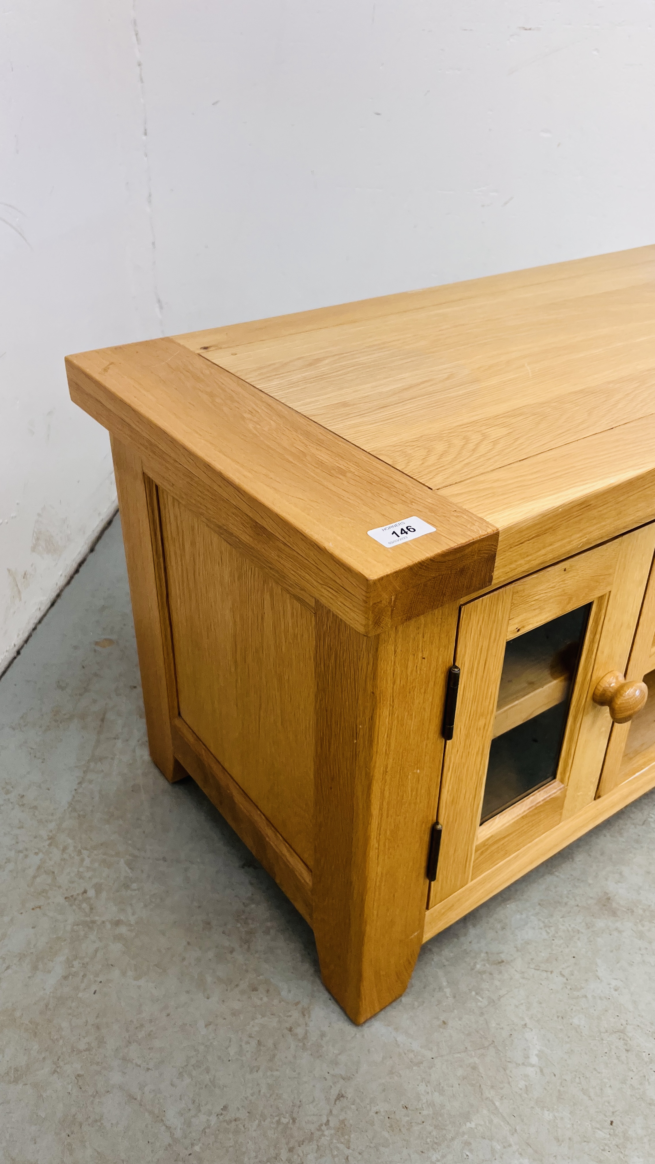 A SOLID LIGHT OAK TELEVISION STAND. - Image 7 of 9