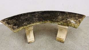 A STONEWORK CURVED GARDEN SEAT LENGTH 128CM.