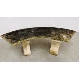 A STONEWORK CURVED GARDEN SEAT LENGTH 128CM.