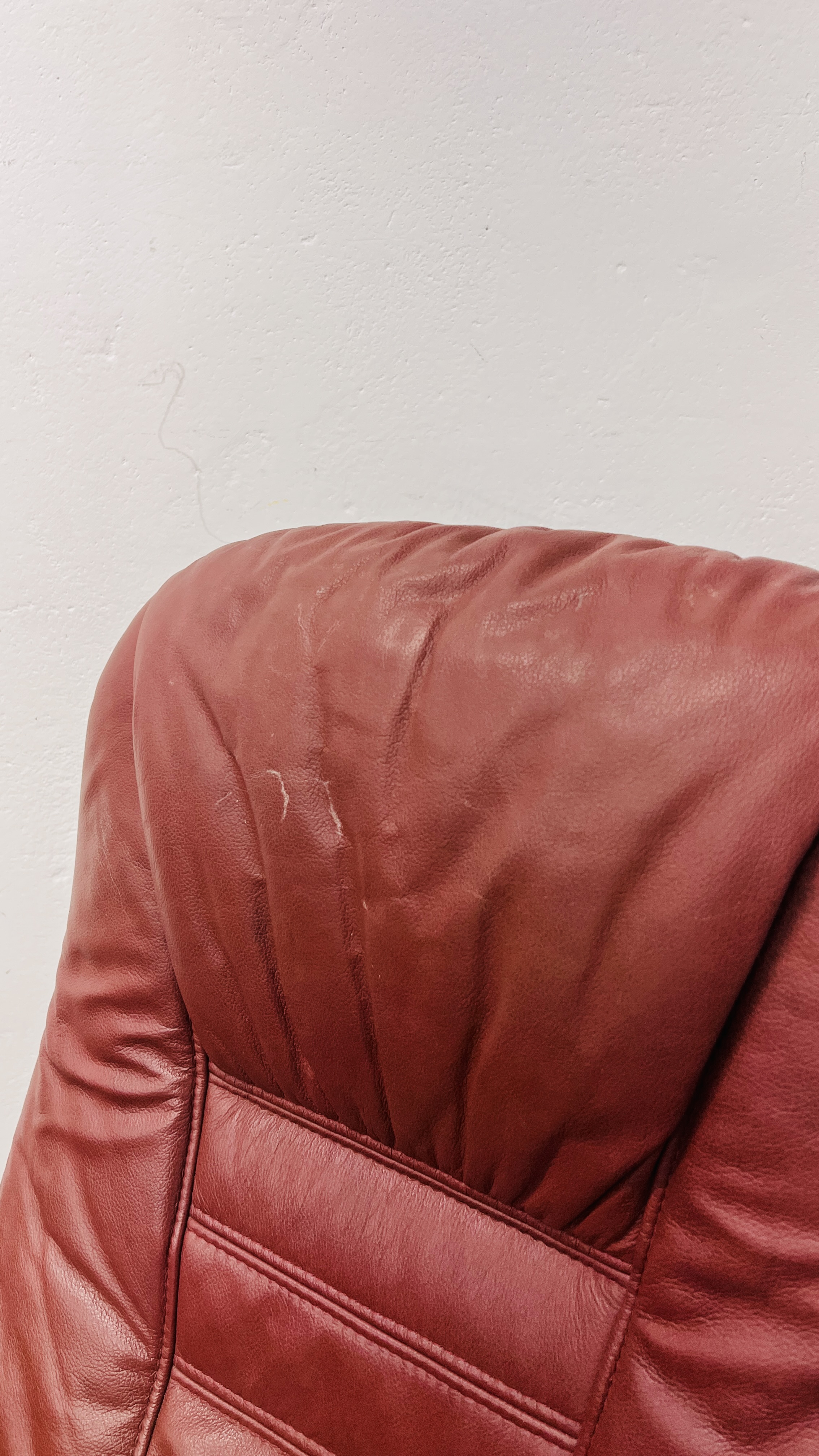 A PAIR OF RED LEATHER REVOLVING ARMCHAIRS WITH FOOTSTOOLS. - Image 15 of 25