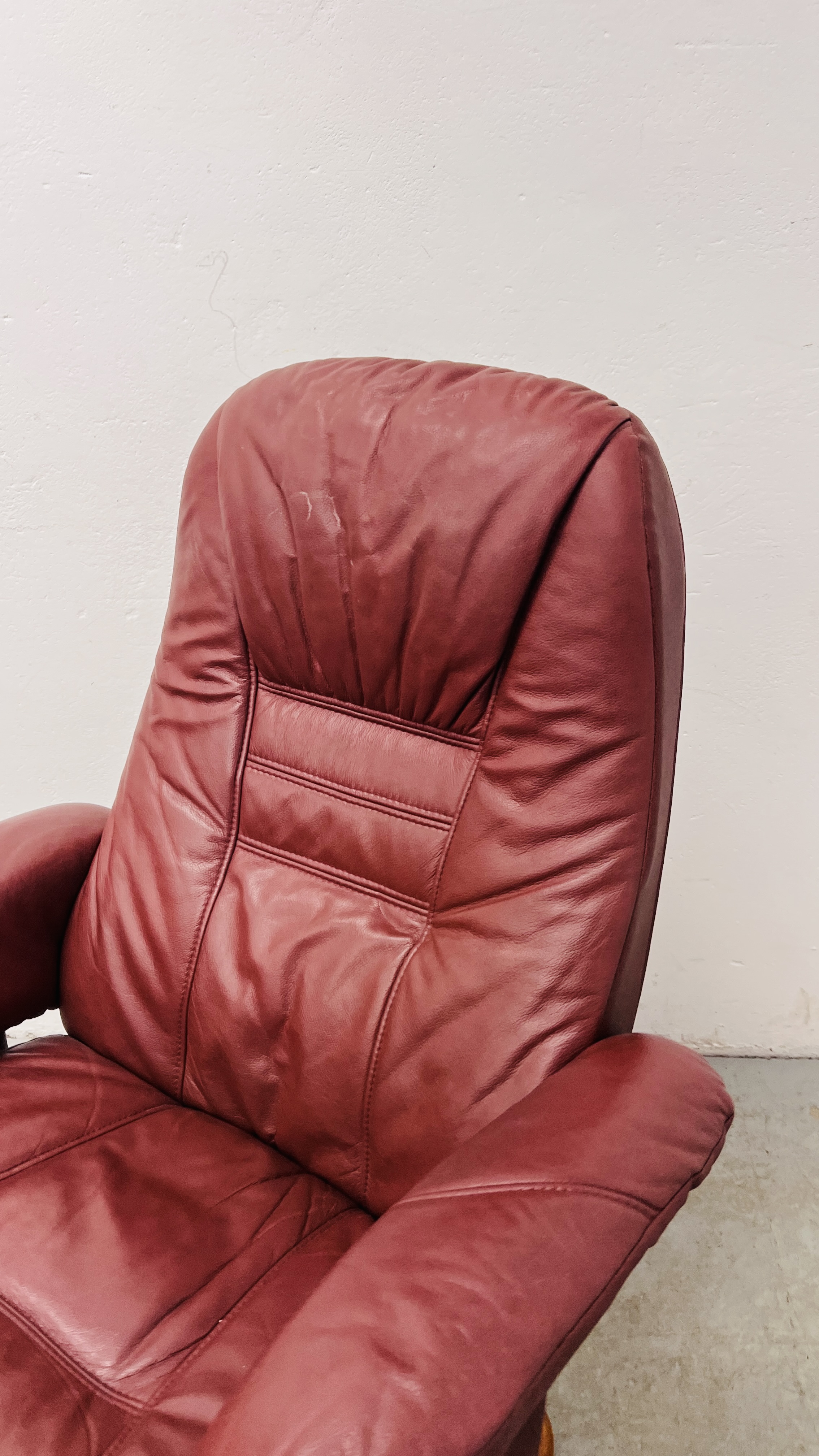 A PAIR OF RED LEATHER REVOLVING ARMCHAIRS WITH FOOTSTOOLS. - Image 11 of 25