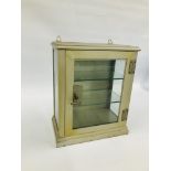 A SMALL VINTAGE STEEL AND GLAZED MEDICAL DISPLAY CABINET WITH KEY.