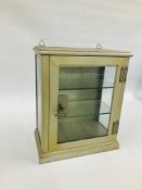 A SMALL VINTAGE STEEL AND GLAZED MEDICAL DISPLAY CABINET WITH KEY.