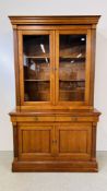 A REPRODUCTION BOOKCASE WITH CABINET AND DRAWERS TO BASE, W 126CM, D 54CM, H 215CM.