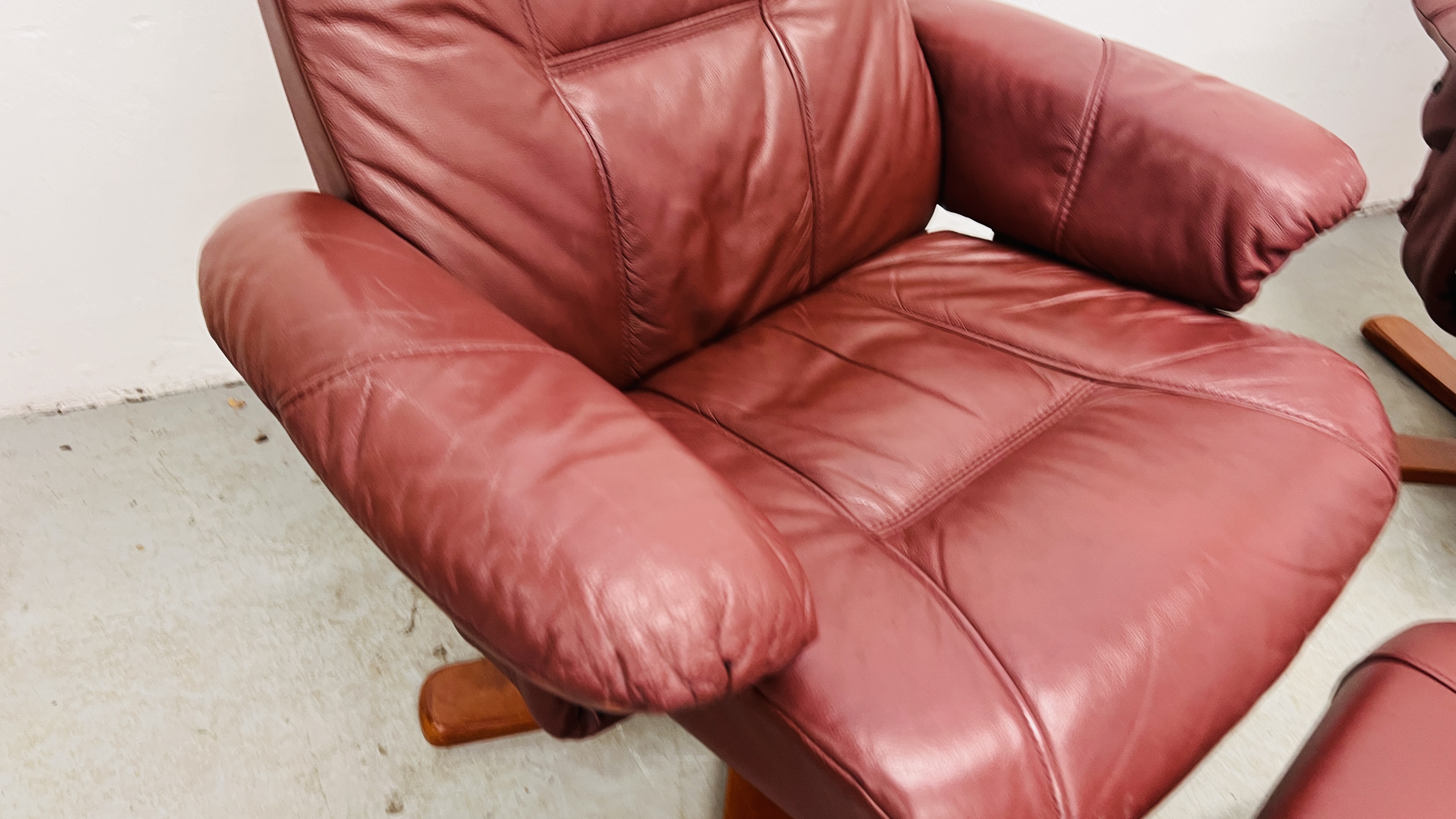 A PAIR OF RED LEATHER REVOLVING ARMCHAIRS WITH FOOTSTOOLS. - Image 6 of 25