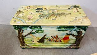 A SOLID PINE BLANKET BOX WITH HAND PAINTED POOH BEAR AND FRIENDS DECORATION CONTAINING BED LINEN,