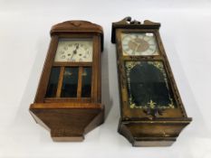 A CASED WALL CLOCK WITH GILT DECORATION ALONG WITH A FURTHER OAK CASED WALL CLOCK A/F.