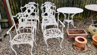 A SET OF 6 CAST METAL GARDEN PATIO CHAIRS ALONG WITH A CIRCULAR CAST METAL TABLE.