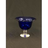 AN IMPRESSIVE BLUE STUDIO GLASS DISH ON CLEAR PEDESTAL BASE BEARING SIGNATURE DAVID WALLACE - H