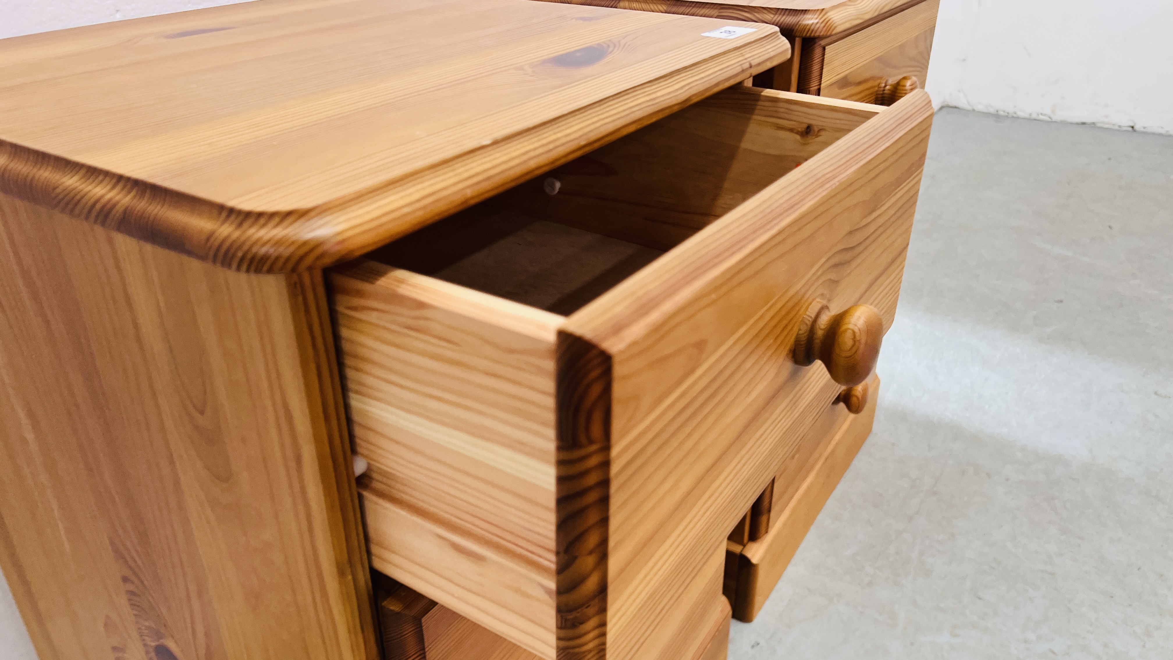 A PAIR OF PINE THREE DRAWER BEDSIDE CHESTS. - Image 5 of 5