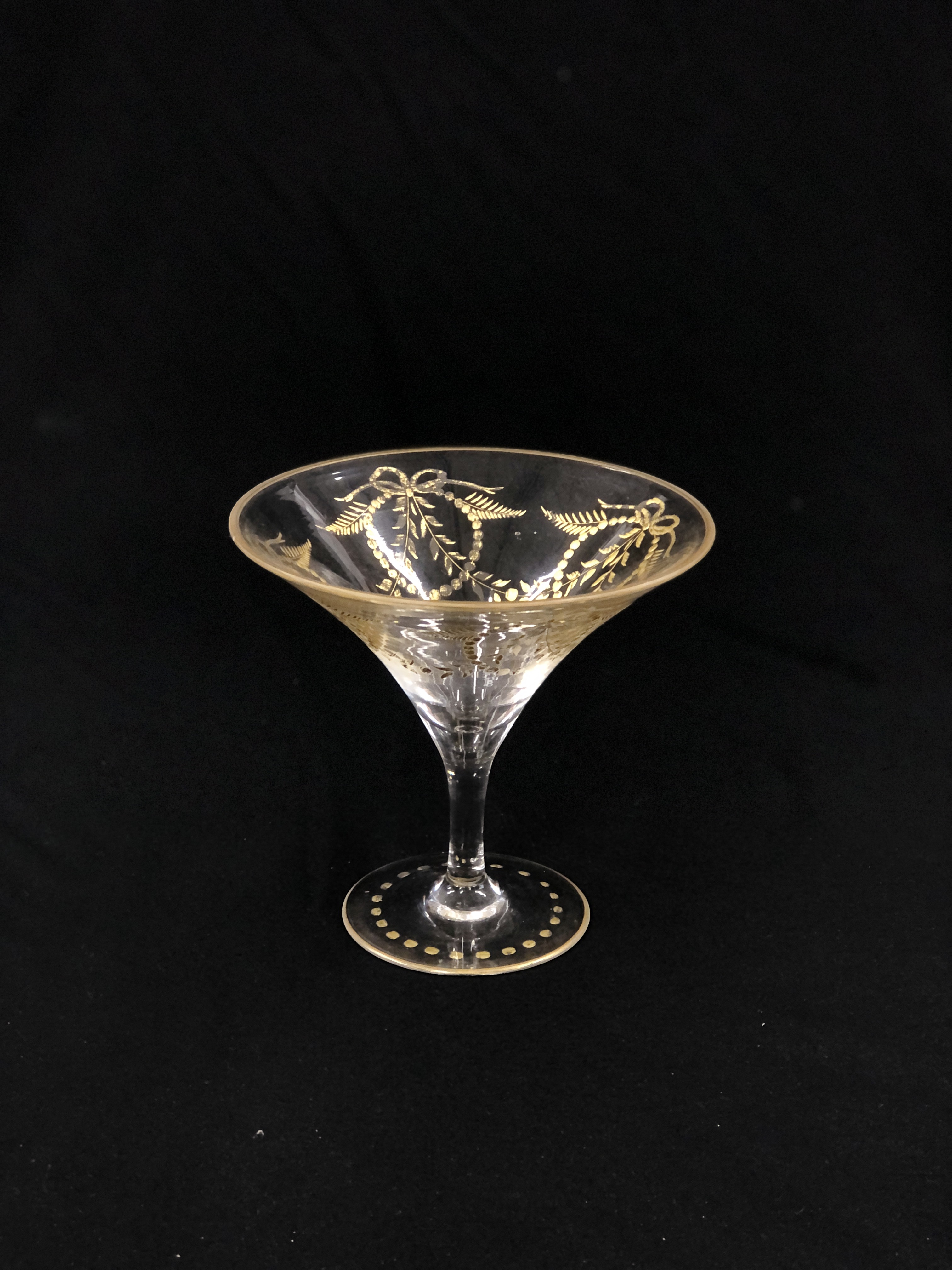 A GILDED GLASS OF CONICAL FORM, PROBABLY VENETIAN, 15.5CM HIGH.