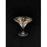 A GILDED GLASS OF CONICAL FORM, PROBABLY VENETIAN, 15.5CM HIGH.