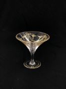 A GILDED GLASS OF CONICAL FORM, PROBABLY VENETIAN, 15.5CM HIGH.