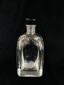 AN ORREFORS CLEAR GLASS DECANTER WITH BLACK STOPPER, ETCHED FISH DESIGN AND INSCRIPTION TO BASE.