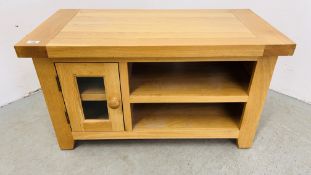 A SOLID LIGHT OAK TELEVISION STAND.