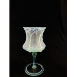 A VENETIAN GOBLET, PALE GREEN WITH SPIRAL OVERLAY ON THE THISTLE SHAPED BOWL, 23CM HIGH.