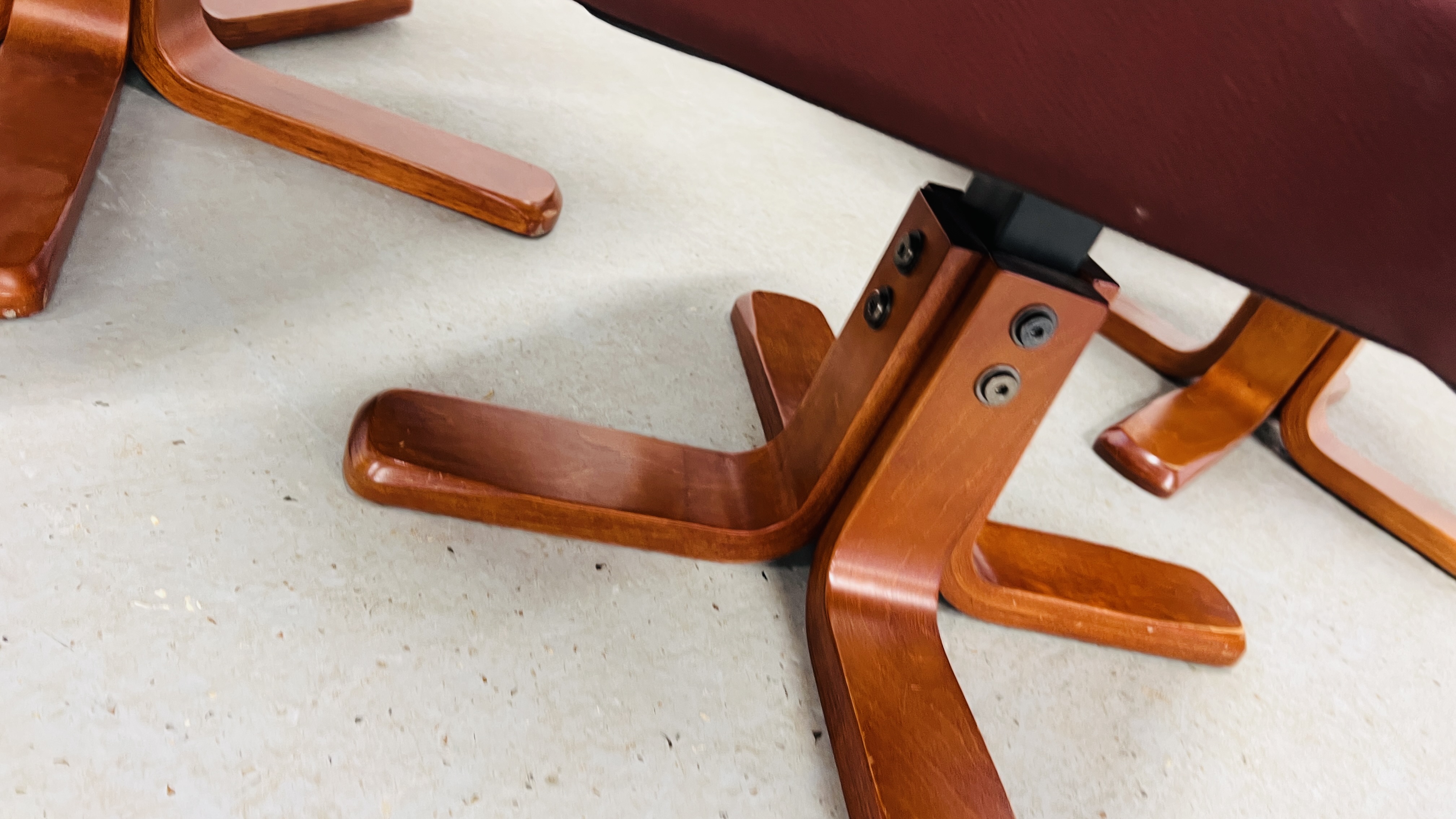 A PAIR OF RED LEATHER REVOLVING ARMCHAIRS WITH FOOTSTOOLS. - Image 24 of 25