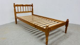 A SOLID PINE SINGLE BEDSTEAD.