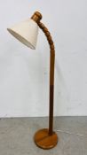 A PINE STANDARD READING LAMP - SOLD AS SEEN.