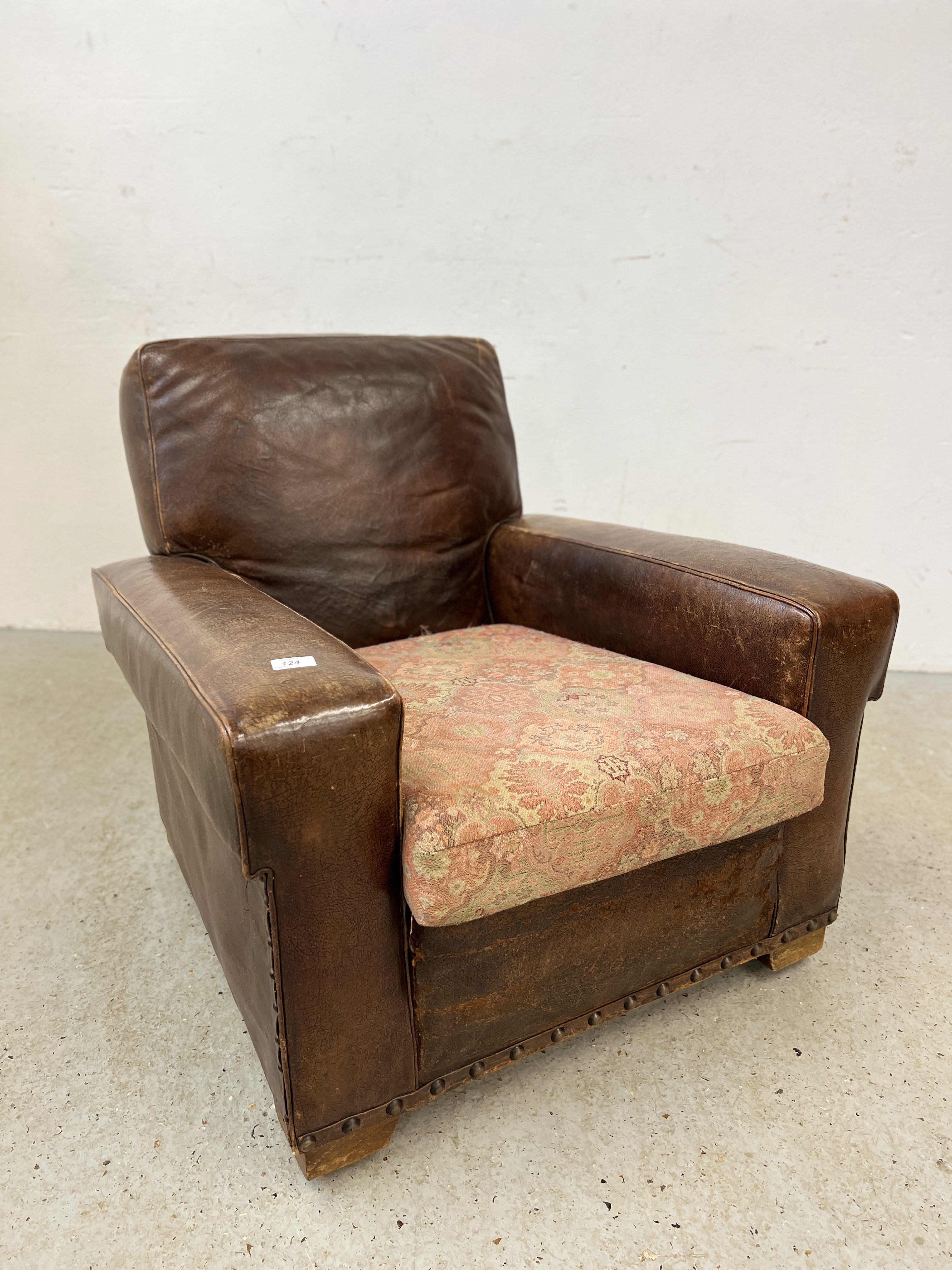 A 1930'S BROWN LEATHER CLUB CHAIR WITH STUDDED DETAIL H 78CM X W 83CM X D 87CM.