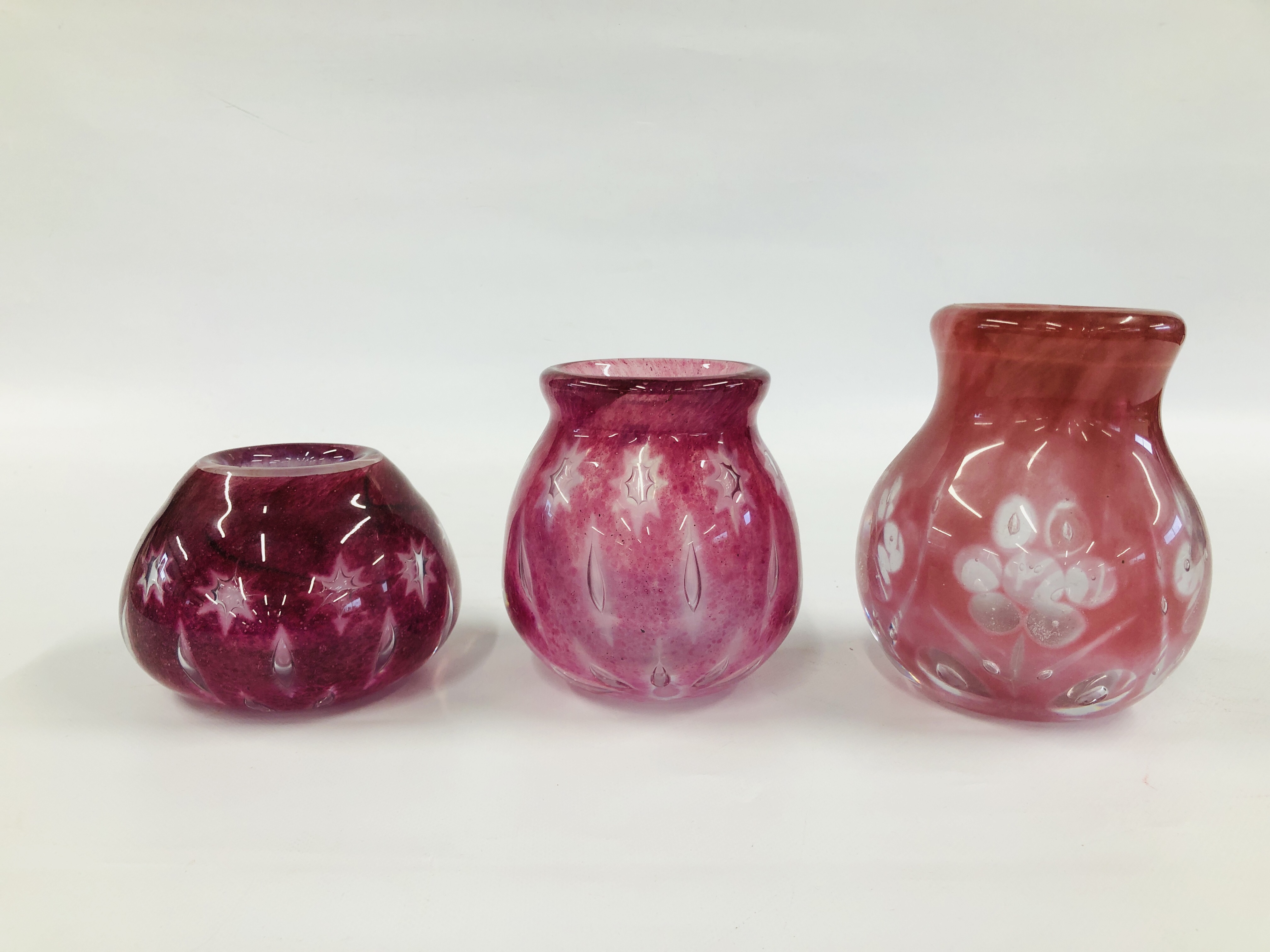THREE PALE PINK STUDIO GLASS VASES WITH AIR TRAPPED DECORATION DESIGNED BY RSW.