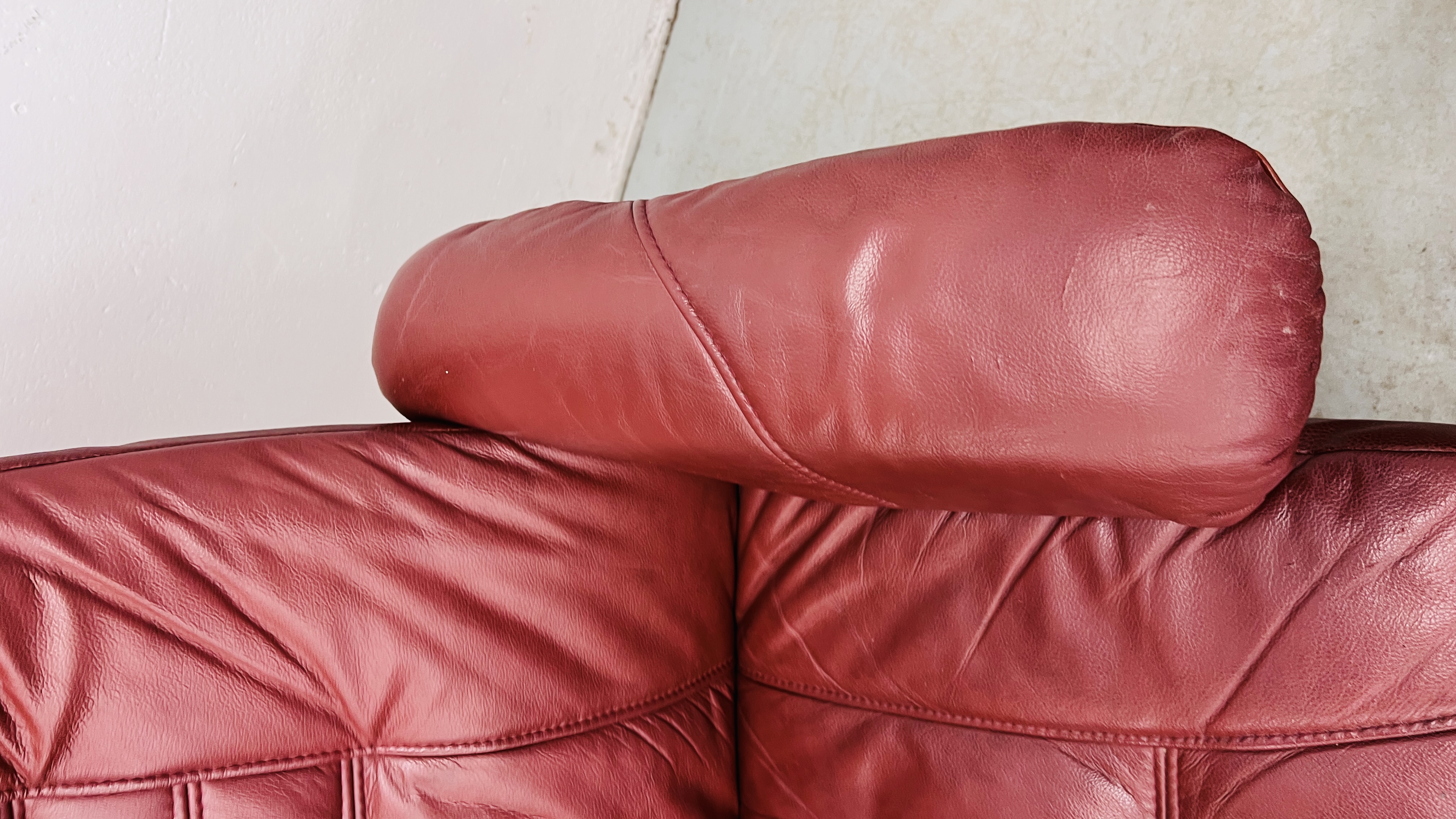 A PAIR OF RED LEATHER REVOLVING ARMCHAIRS WITH FOOTSTOOLS. - Image 20 of 25