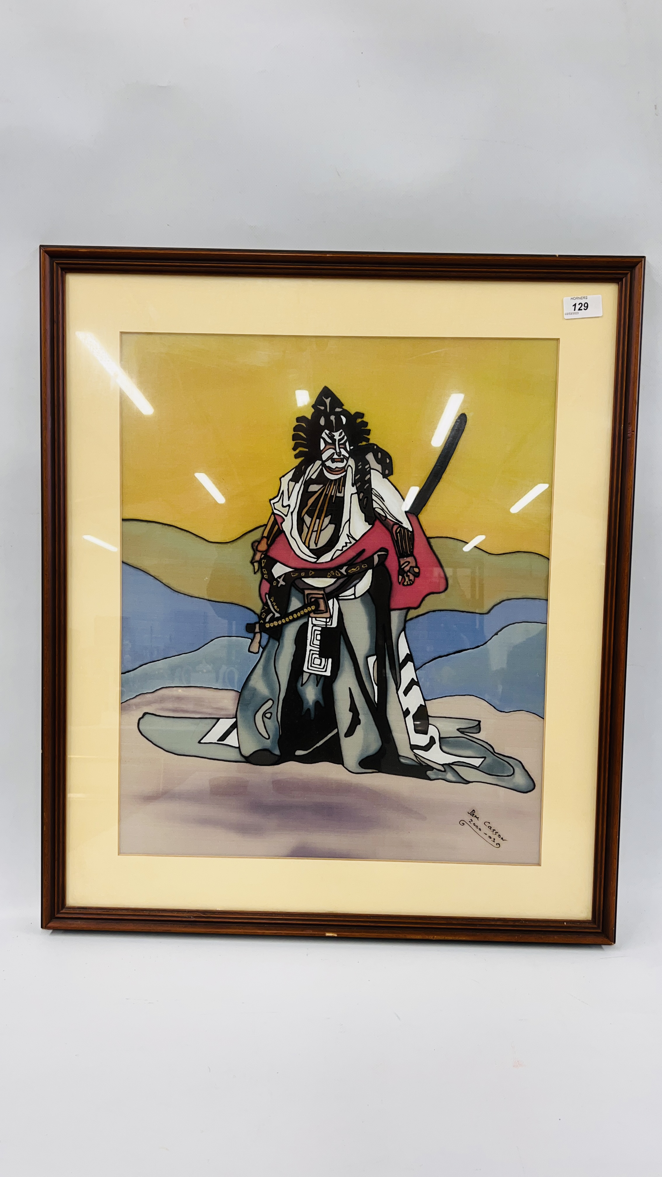 A FRAMED AND MOUNTED SILK OF A WARRIOR BEARING SIGNATURE PAM CASSON 2000.