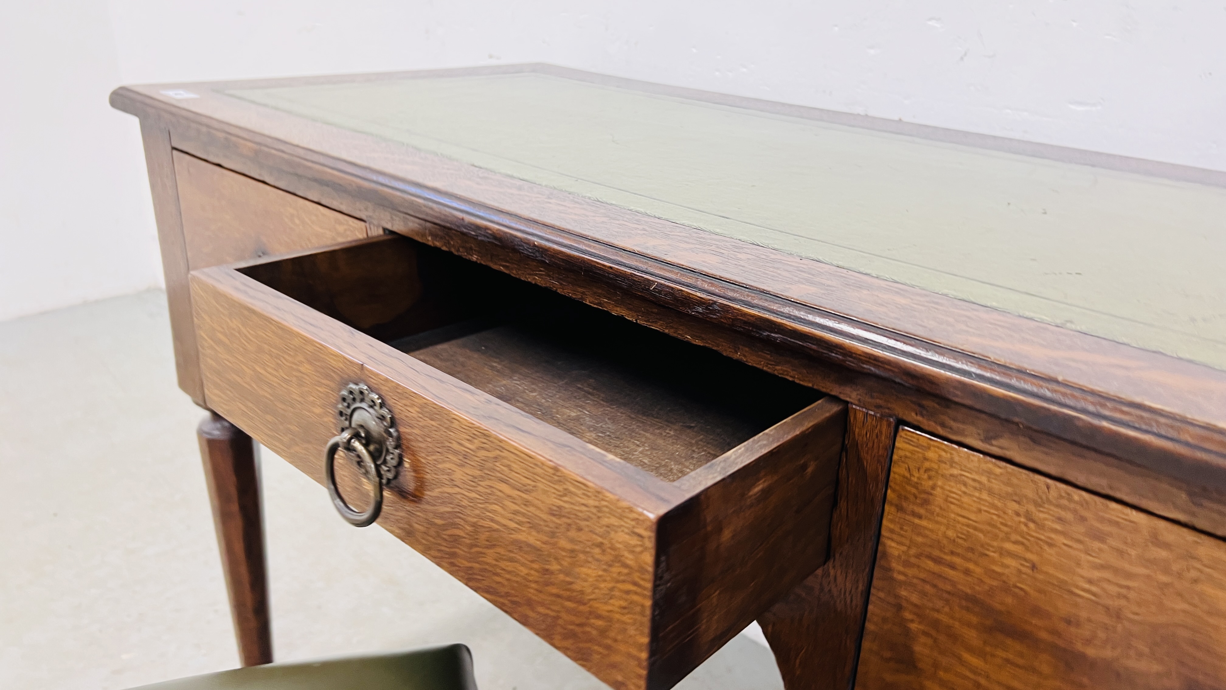 A SOLID OAK THREE DRAWER WRITING DESK WITH GREEN TOOLED LEATHERETTE WRITING SURFACE, W 120CM, - Image 12 of 16