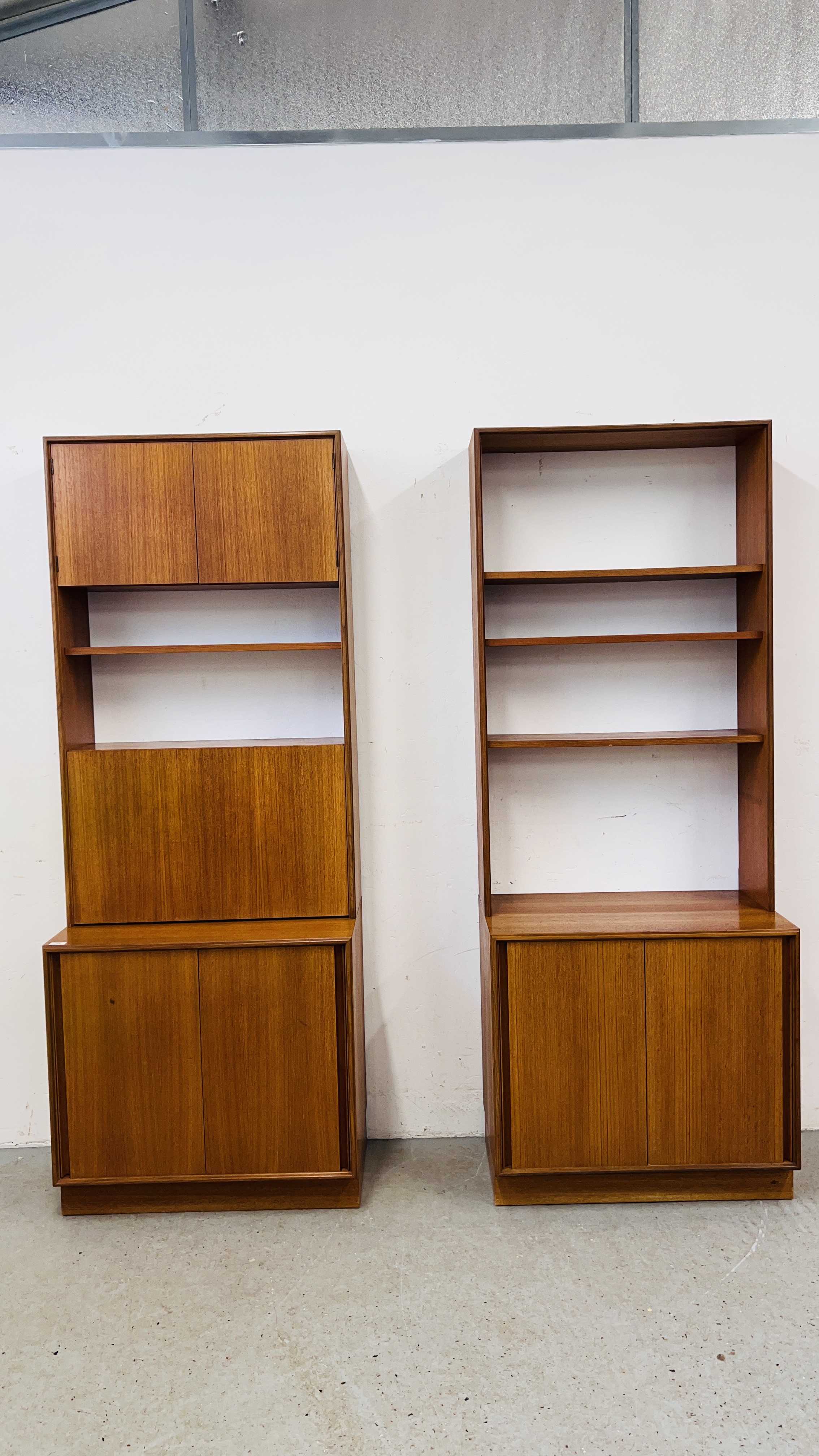 TWO G PLAN TEAK WALL UNITS, EACH W 76CM, D 46CM, H 199CM.