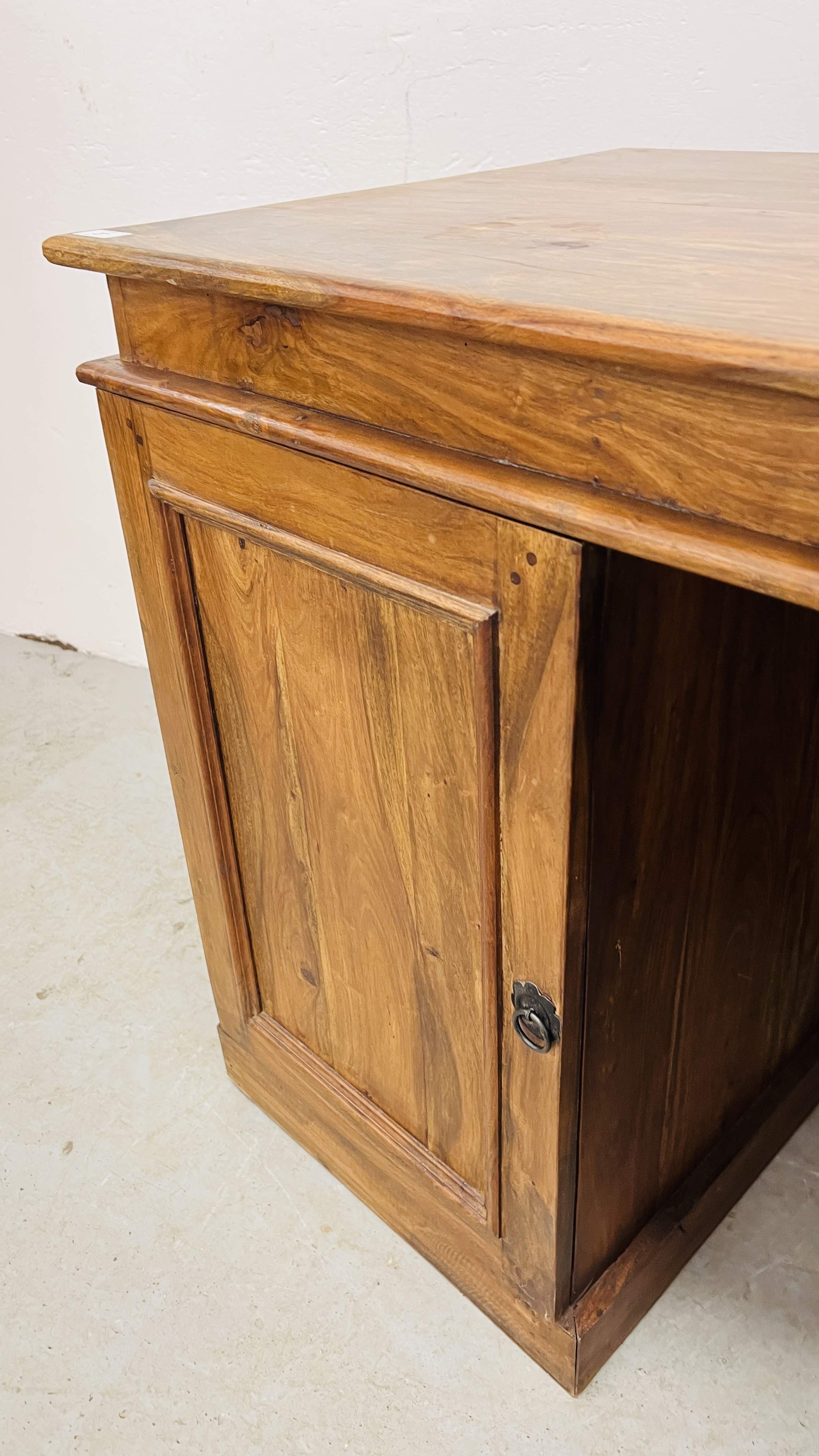 AN ORIENTAL HARDWOOD FOUR DRAWER DESK WITH SINGLE CUPBOARD 150CM. WIDE. - Image 7 of 9