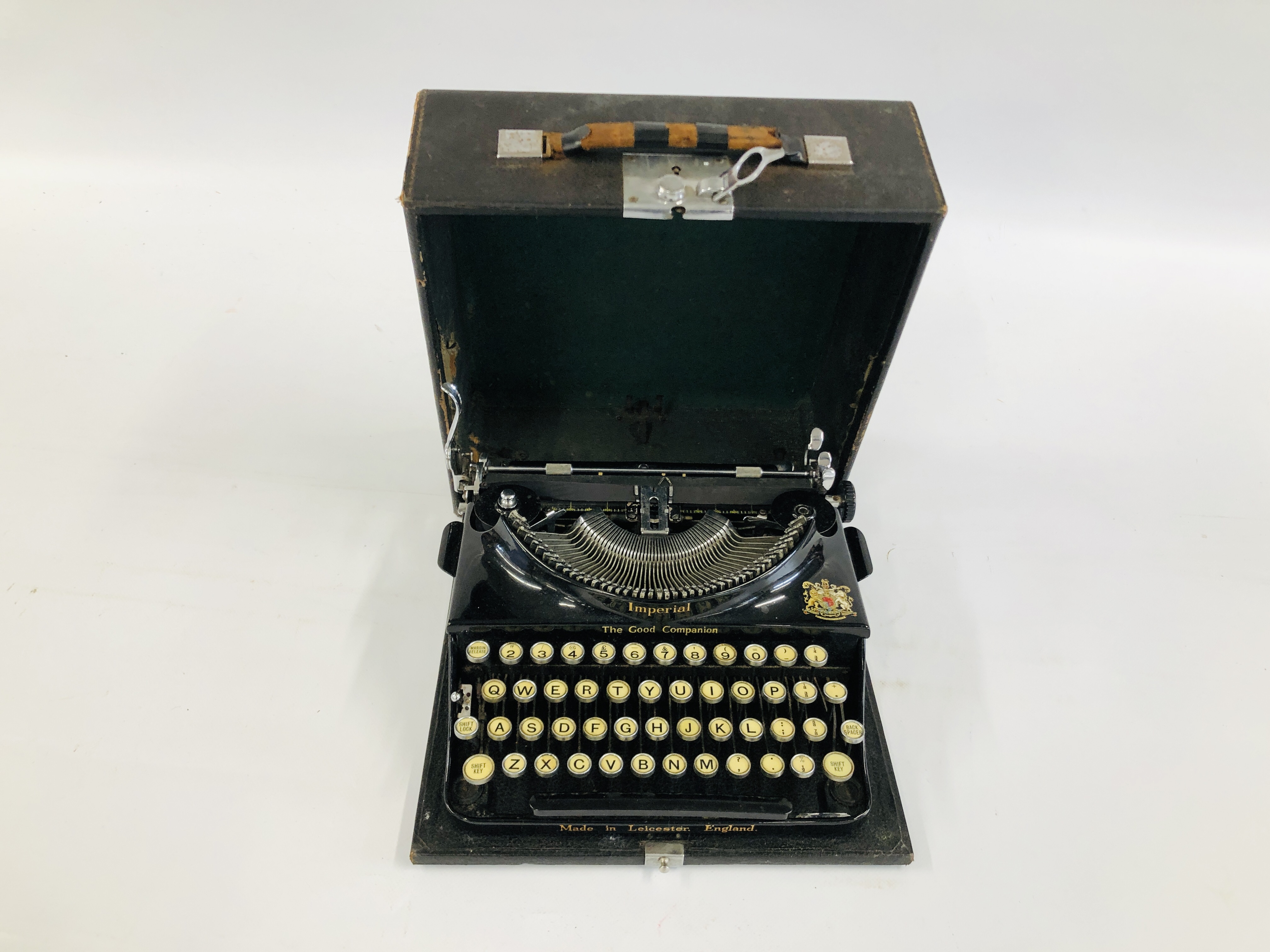 A VINTAGE IMPERIAL TYPEWRITER IN CASE.