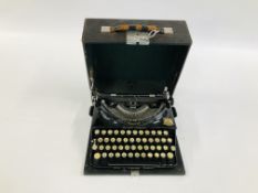 A VINTAGE IMPERIAL TYPEWRITER IN CASE.