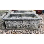 A PAIR OF HEAVY RECTANGULAR STONEWORK PLANTING TROUGHS WITH RELIEF CHERUB DECORATION. W 88CM.