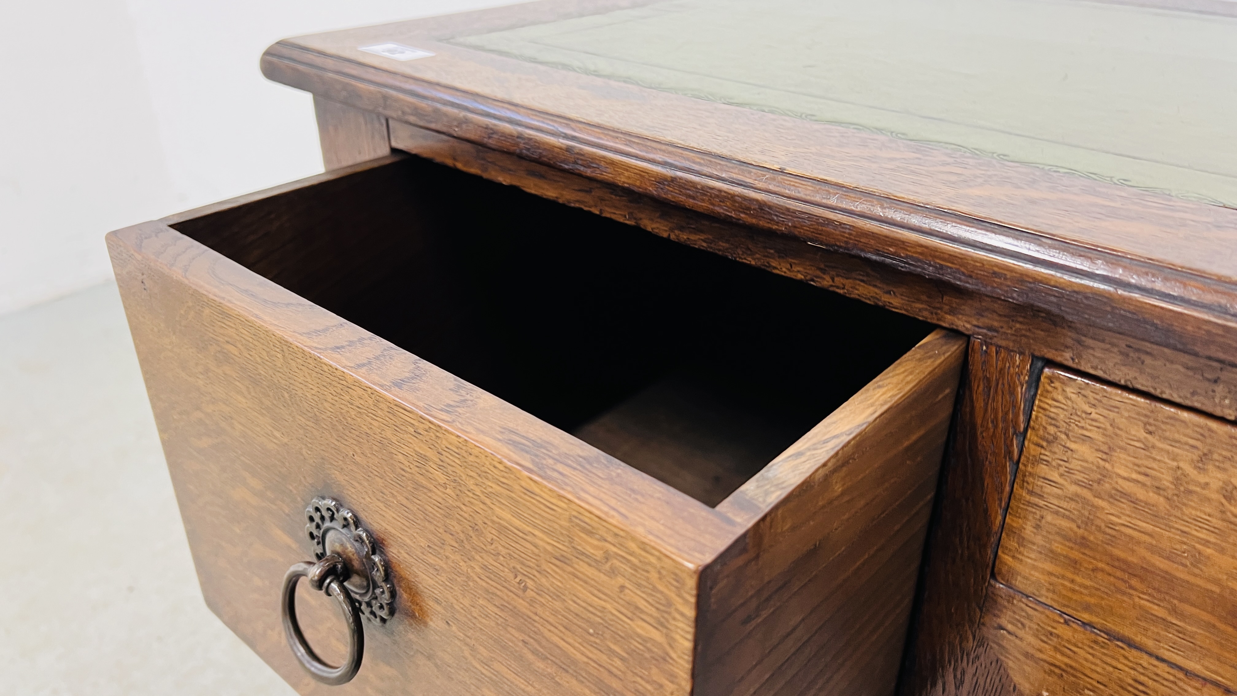 A SOLID OAK THREE DRAWER WRITING DESK WITH GREEN TOOLED LEATHERETTE WRITING SURFACE, W 120CM, - Image 11 of 16