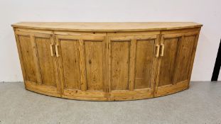 A LARGE SOLID PINE BOW FRONTED 4 DOOR SIDE CABINET, W 246CM, D 61CM, H 96CM.