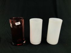 A PAIR OF WHITE ART GLASS STUDIO VASES H 24CM. ALONG WITH A SIMILAR CRANBERRY FINISH EXAMPLE H 25CM.