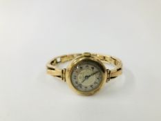 A LADIES 9CT GOLD VINTAGE WRIST WATCH BY THOMAS RUSSELL & SON ON 9CT GOLD EXPANDABLE BRACELET.