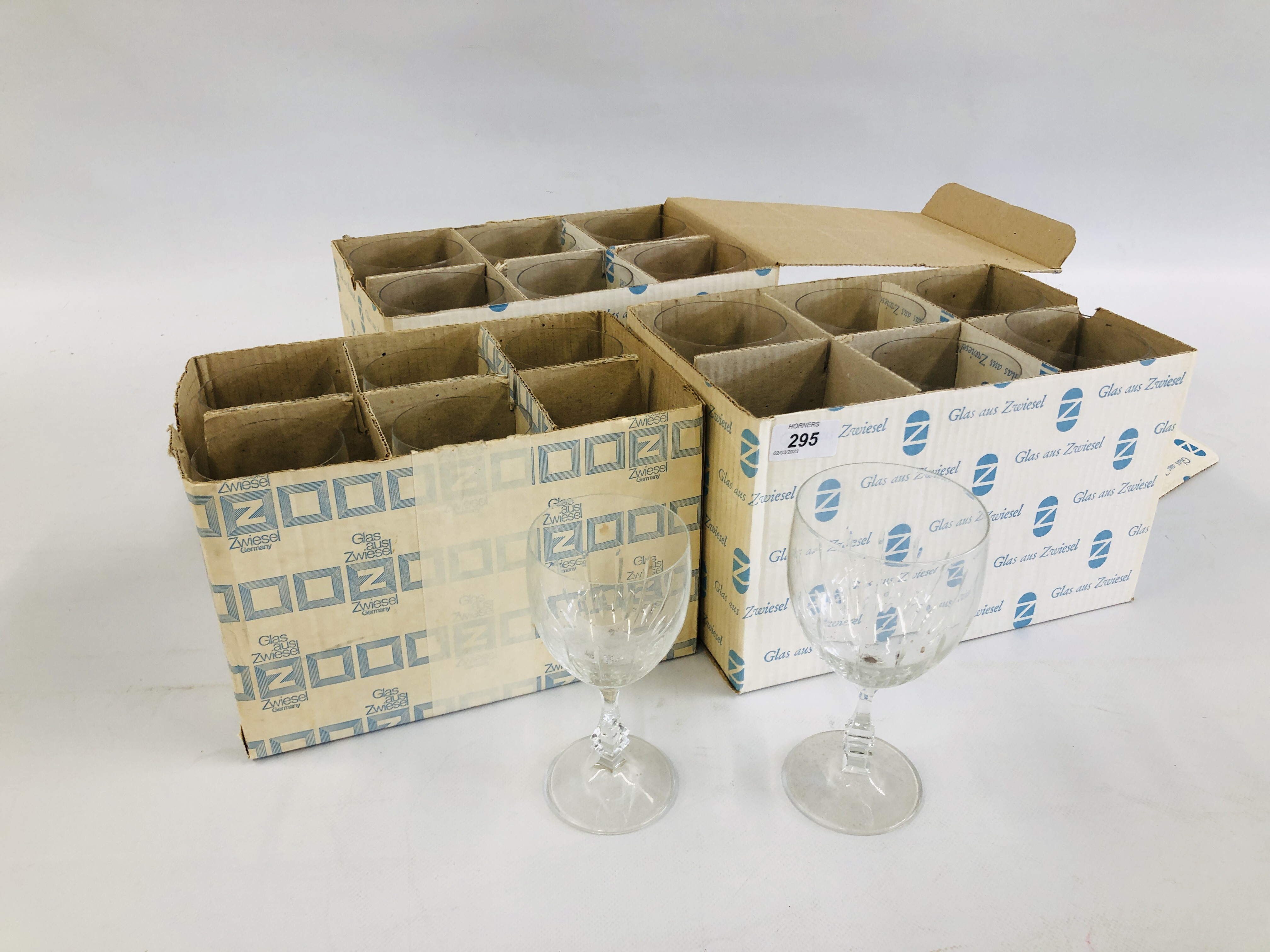 A GROUP OF ZWIESEL GLAS IN ORIGINAL BOXES TO INCLUDE 12 LARGE WINE GLASSES AND 6 SMALLER.