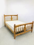 A MODERN HONEY PINE DOUBLE BED FRAME WITH MATTRESS.