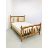 A MODERN HONEY PINE DOUBLE BED FRAME WITH MATTRESS.