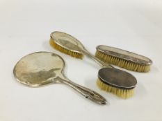 A THREE PIECE SILVER BACKED DRESSING TABLE SET AND ONE ADDITIONAL SILVER BACKED BRUSH.