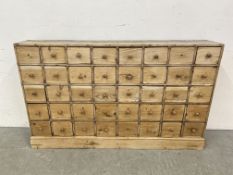 AN ANTIQUE PINE 40 DRAWER APOTHECARY / HABERDASHERY SHOP FITMENT - W 135CM X D 25CM X H 83CM.