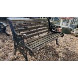 A GARDEN BENCH WITH SLATTED SEAT AND DECORATIVE CAST ENDS, LENGTH 127CM.