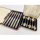 A CASED SET OF SIX SILVER COFFEE SPOONS WITH GOLFING DESIGN ALONG WITH A CASED SET OF SIX SILVER