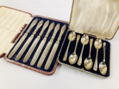 A CASED SET OF SIX SILVER COFFEE SPOONS WITH GOLFING DESIGN ALONG WITH A CASED SET OF SIX SILVER