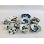A GROUP OF CHINESE BLUE AND WHITE PLATES AND DISHES DECORATED WITH A FISH SYMBOL ALONG WITH A