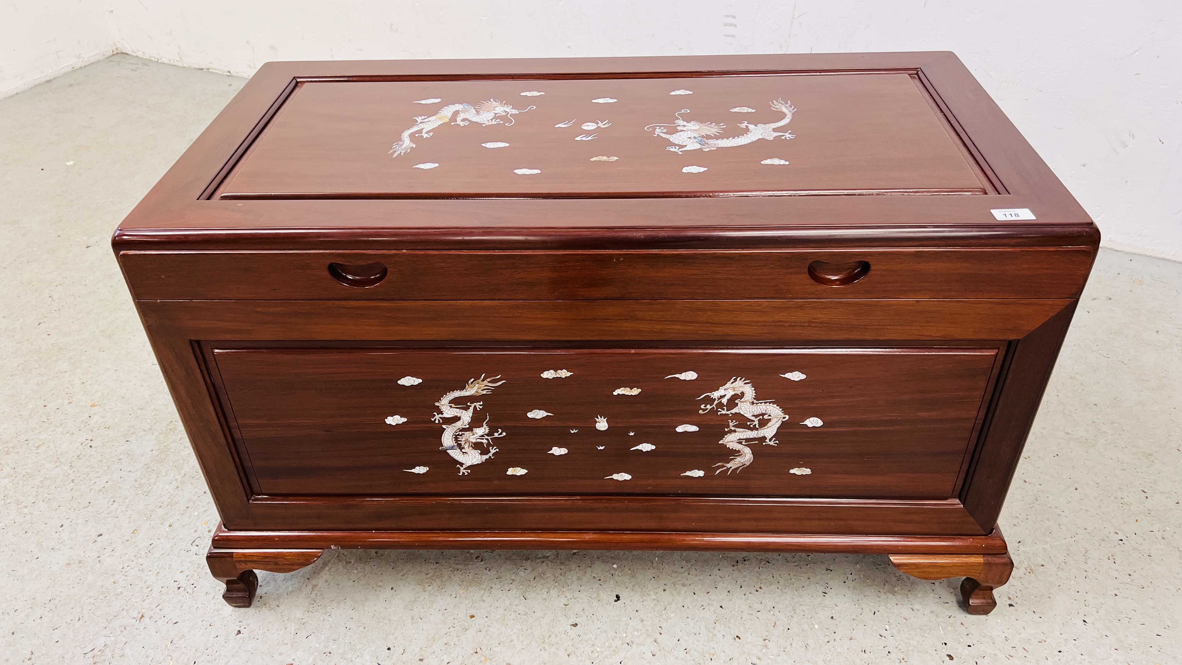 A GOOD QUALITY HARDWOOD ORIENTAL CHEST WITH MOTHER OF PEARL DRAGON INLAY.