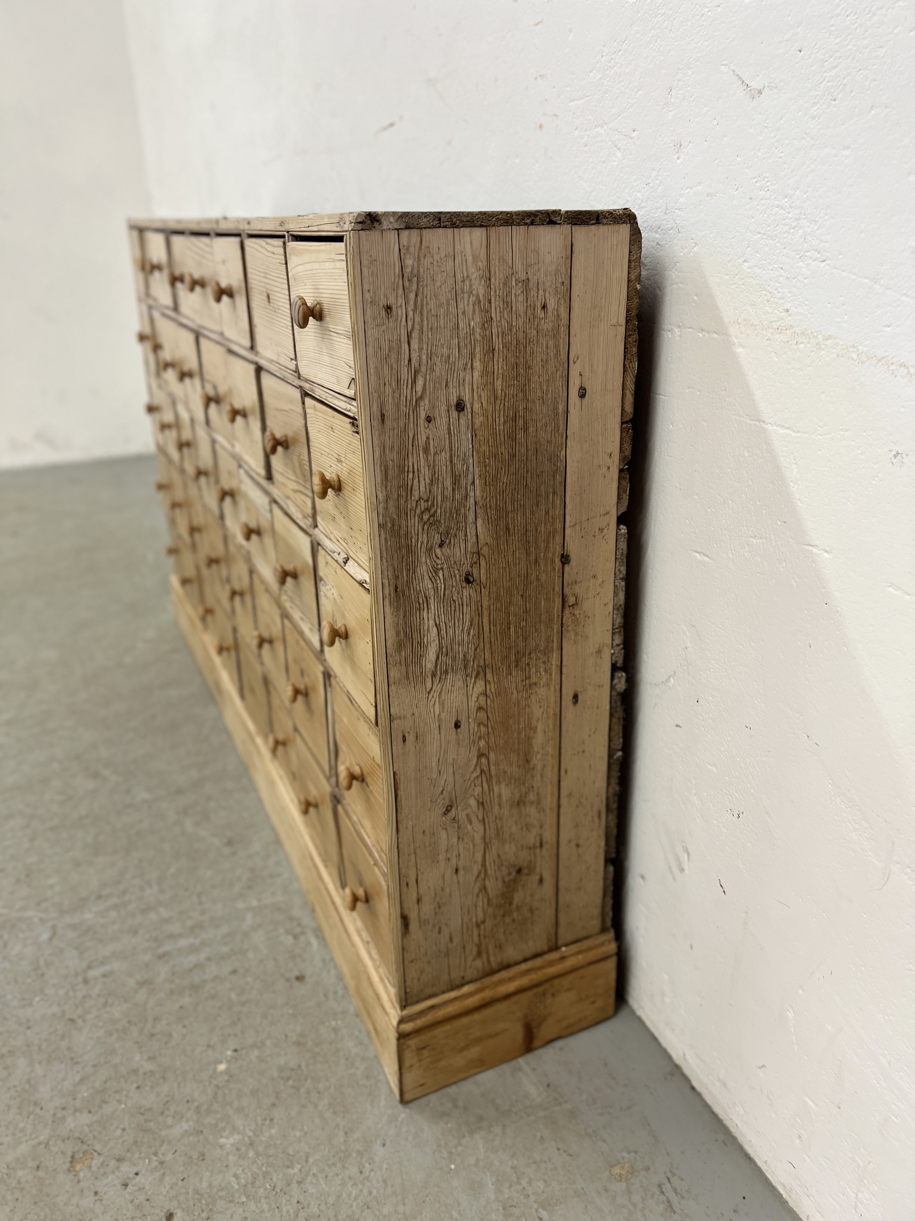 AN ANTIQUE PINE 40 DRAWER APOTHECARY / HABERDASHERY SHOP FITMENT - W 135CM X D 25CM X H 83CM. - Image 6 of 14